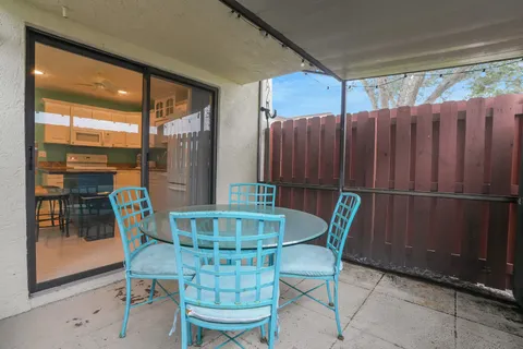 a table and chairs in a patio