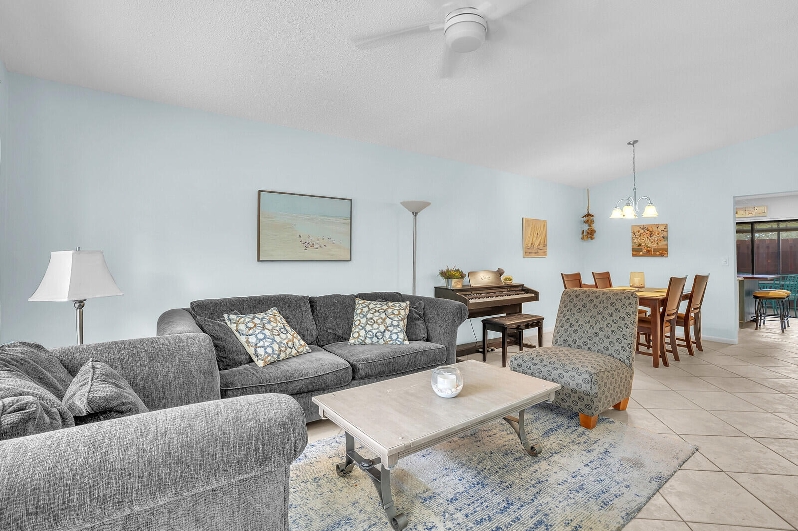8020 Southeast Villa Circle Hobe Sound, FL 33455 - Photo 5 of 19 a living room with furniture and a table