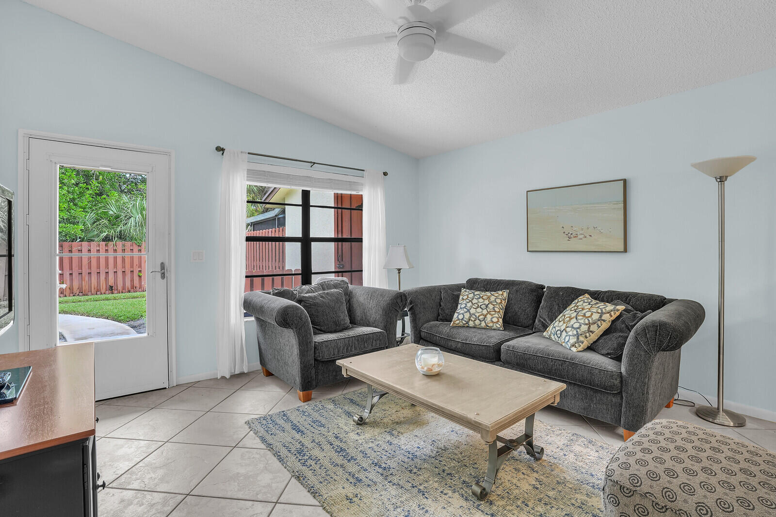 8020 Southeast Villa Circle Hobe Sound, FL 33455 - Photo 6 of 19 a living room with furniture and a window