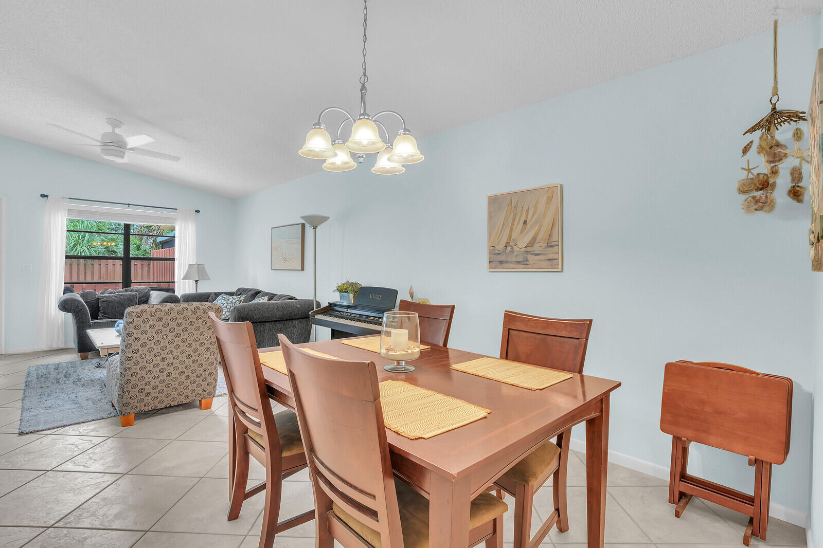 8020 Southeast Villa Circle Hobe Sound, FL 33455 - Photo 9 of 19 a view of a dining room with furniture and wooden floor