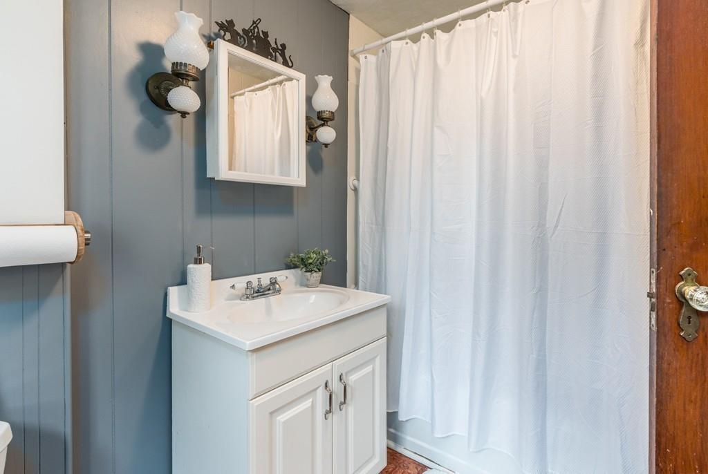 42 Ballardvale Road Andover, MA 01810 - Photo 21 of 34 a bathroom with a sink vanity and mirror