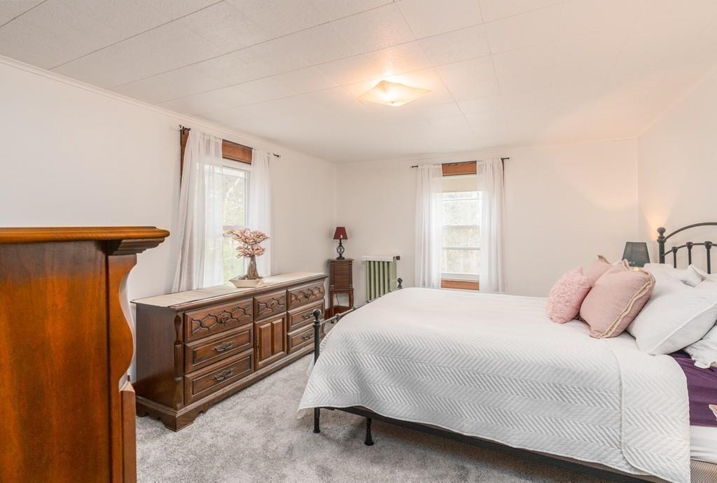 42 Ballardvale Road Andover, MA 01810 - Photo 22 of 34 a bedroom with a bed and a dresser