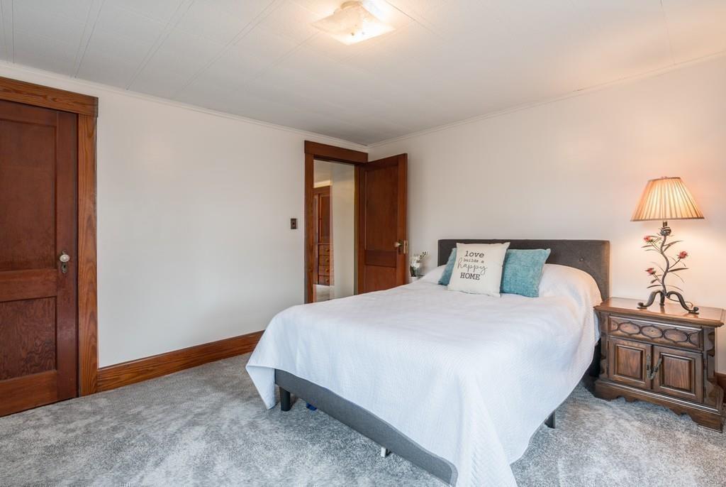 42 Ballardvale Road Andover, MA 01810 - Photo 24 of 34 a bedroom with a bed and a lamp