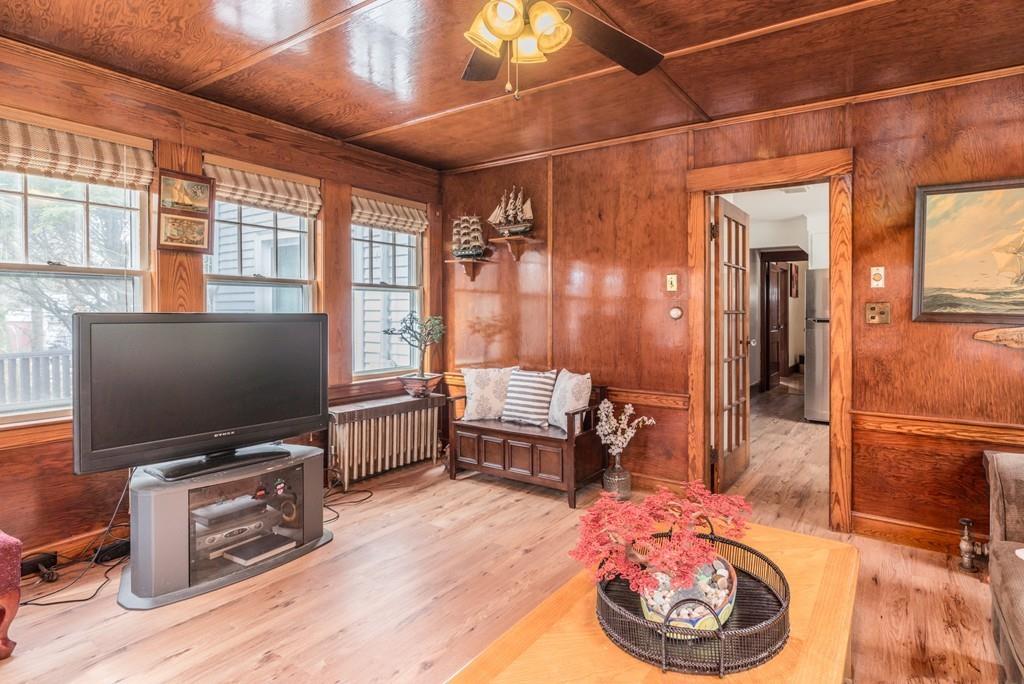 42 Ballardvale Road Andover, MA 01810 - Photo 3 of 34 a room with furniture and flat screen tv