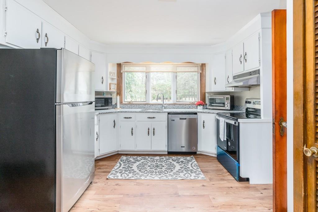 42 Ballardvale Road Andover, MA 01810 - Photo 5 of 34 a kitchen with a sink stove and refrigerator