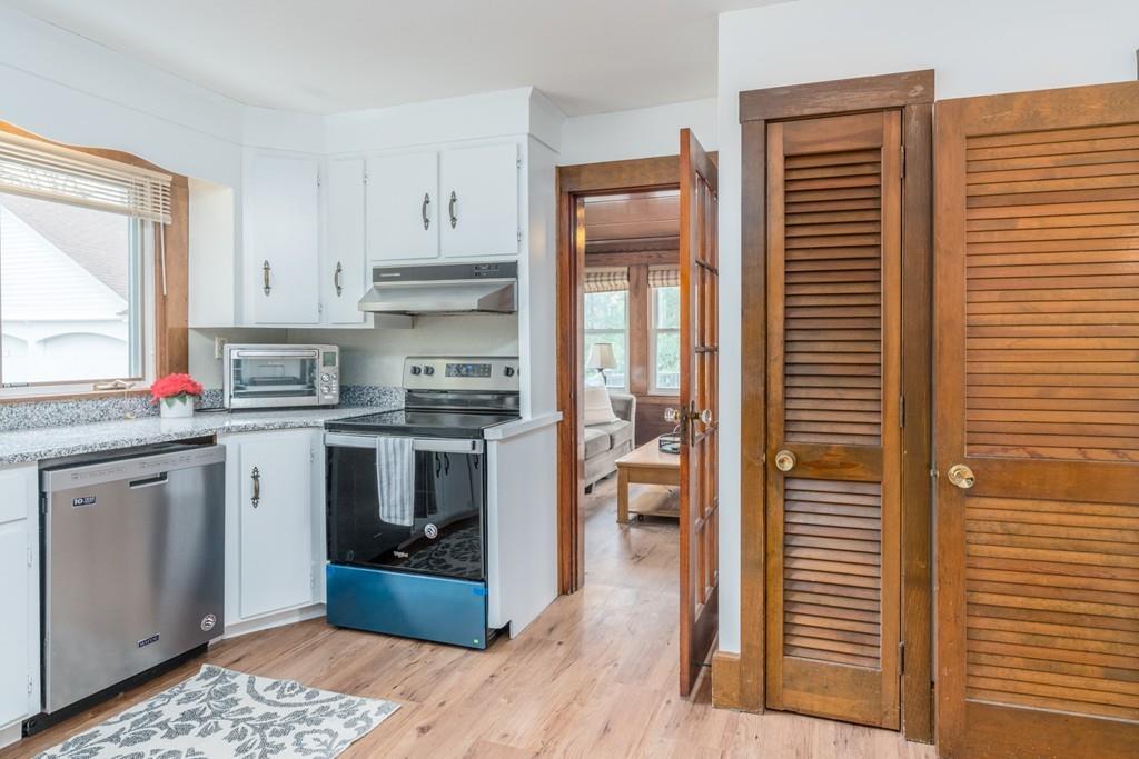 42 Ballardvale Road Andover, MA 01810 - Photo 7 of 34 a kitchen with a refrigerator and a stove