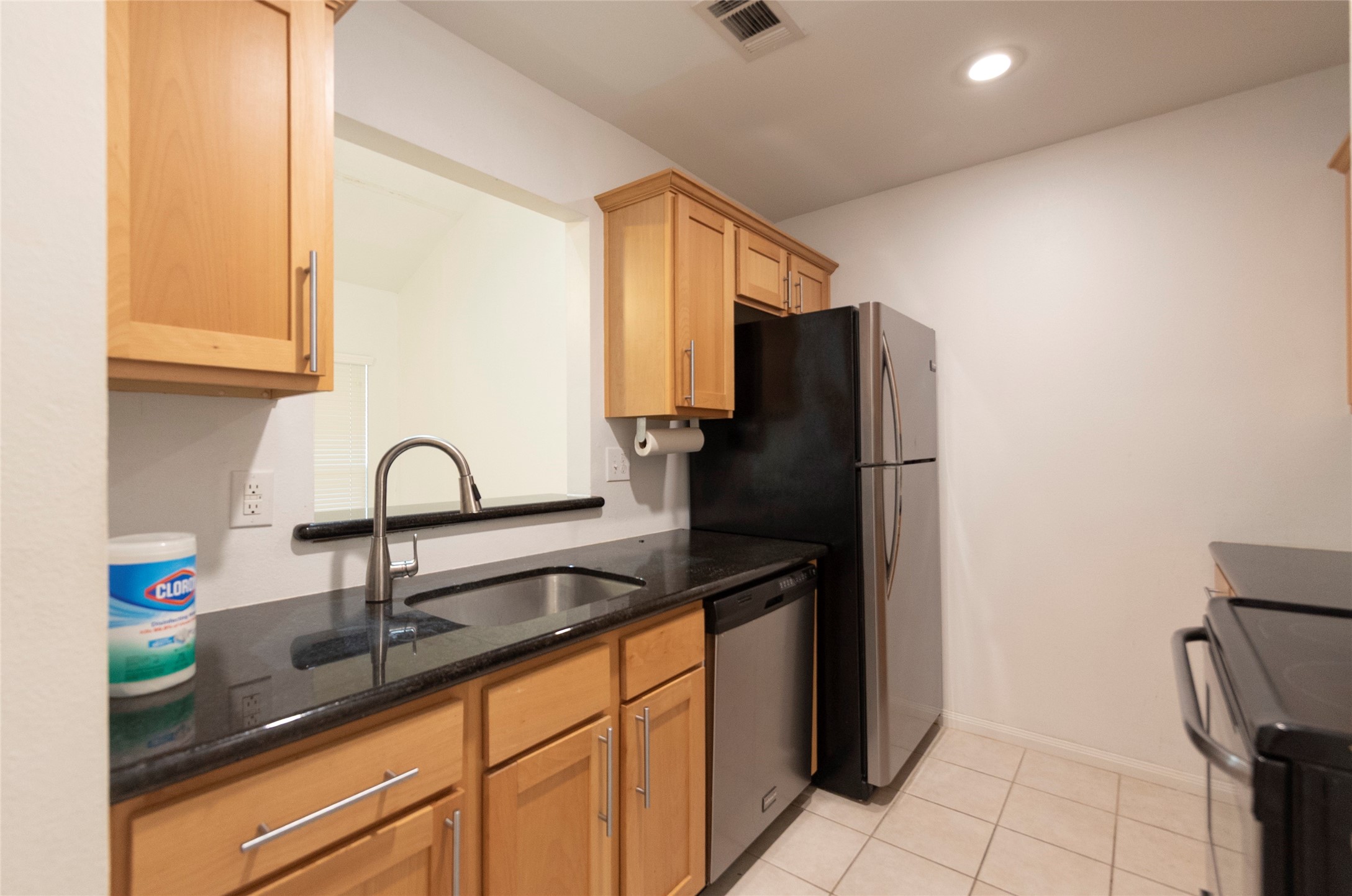 1100 Augusta Drive, Unit 76 Houston, TX 77057 - Photo 12 of 12 a kitchen with stainless steel appliances a refrigerator and a sink