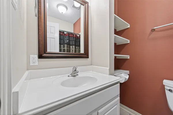 a bathroom with a sink and a mirror
