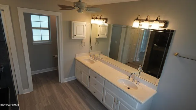 a bathroom with a shower a toilet and a sink