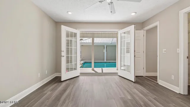 a view of a chairs and table in the patio