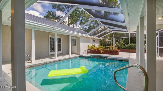 a view of a room with wooden floor and a window