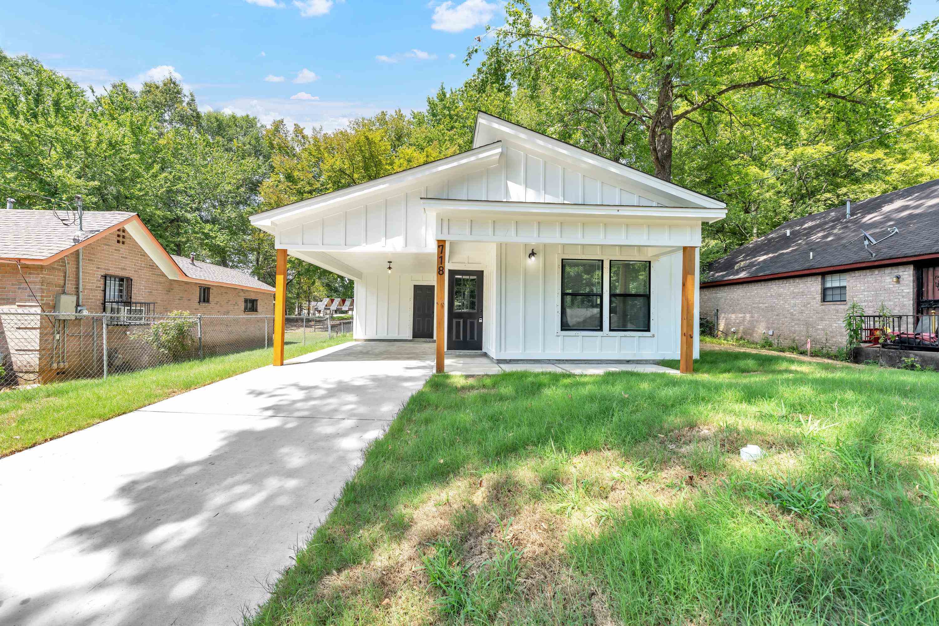 a view of a yard in front view of a house