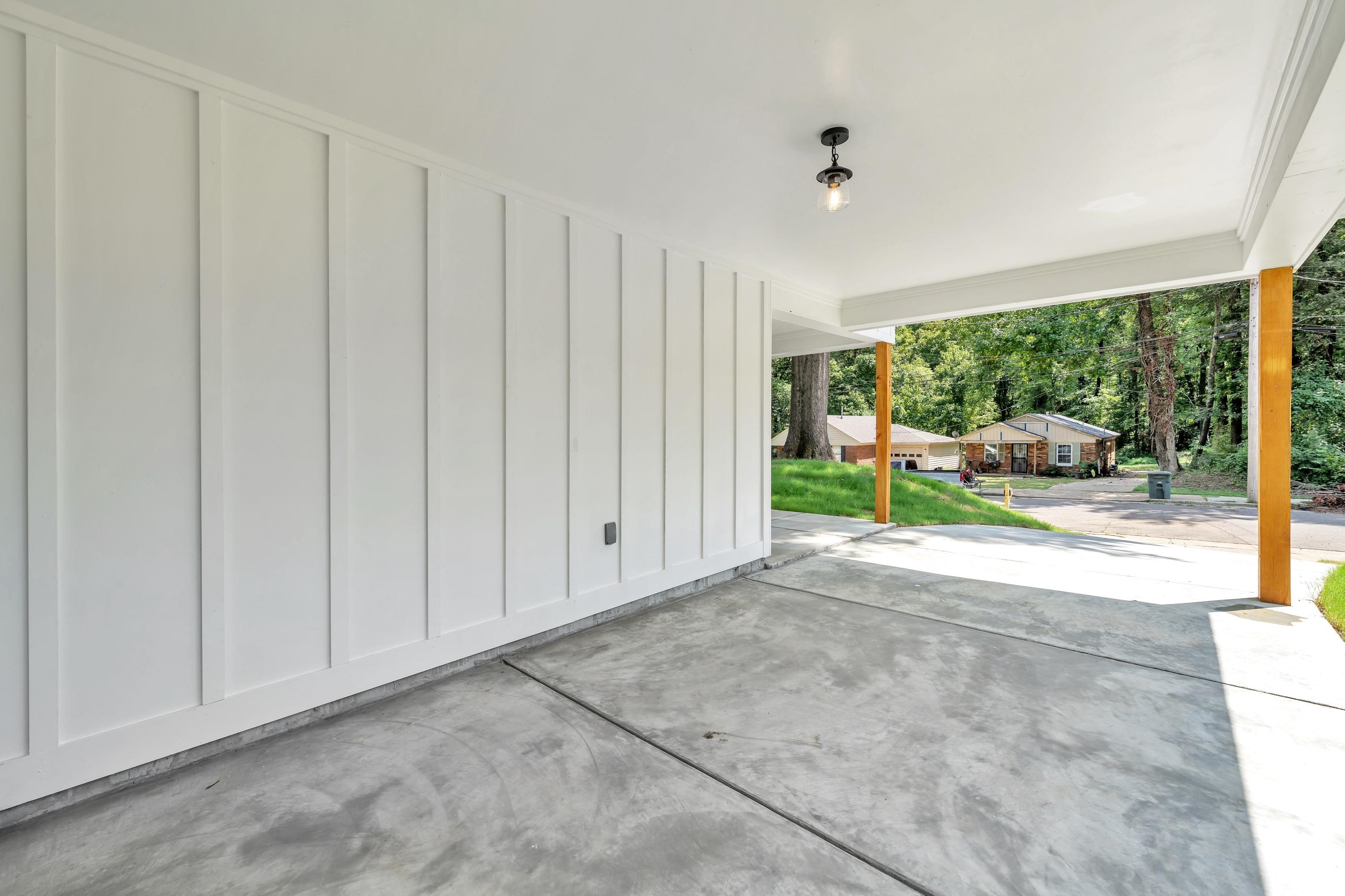 718 Hazelwood Road Memphis, TN 38109 - Photo 2 of 11 a view of backyard with large window and plants