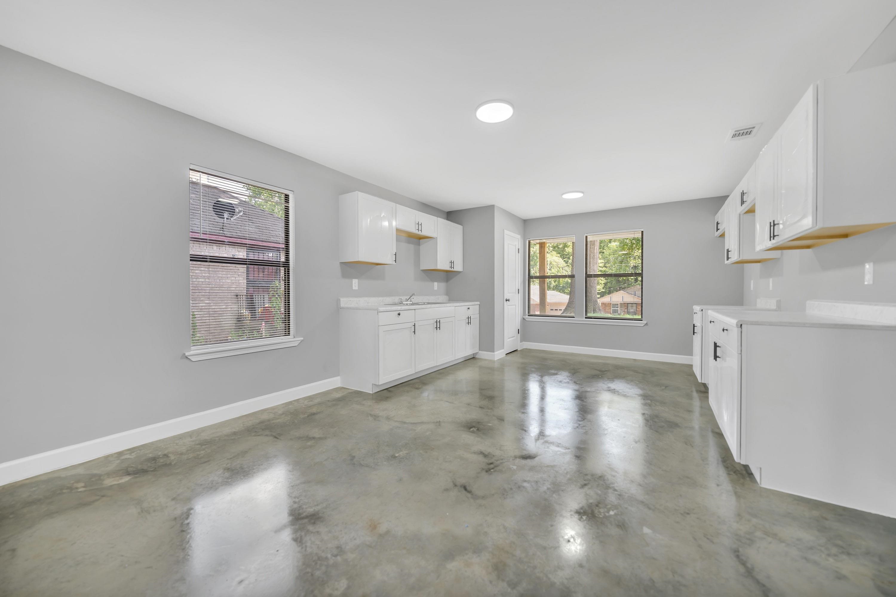 718 Hazelwood Road Memphis, TN 38109 - Photo 5 of 11 a view of a kitchen with furniture and windows