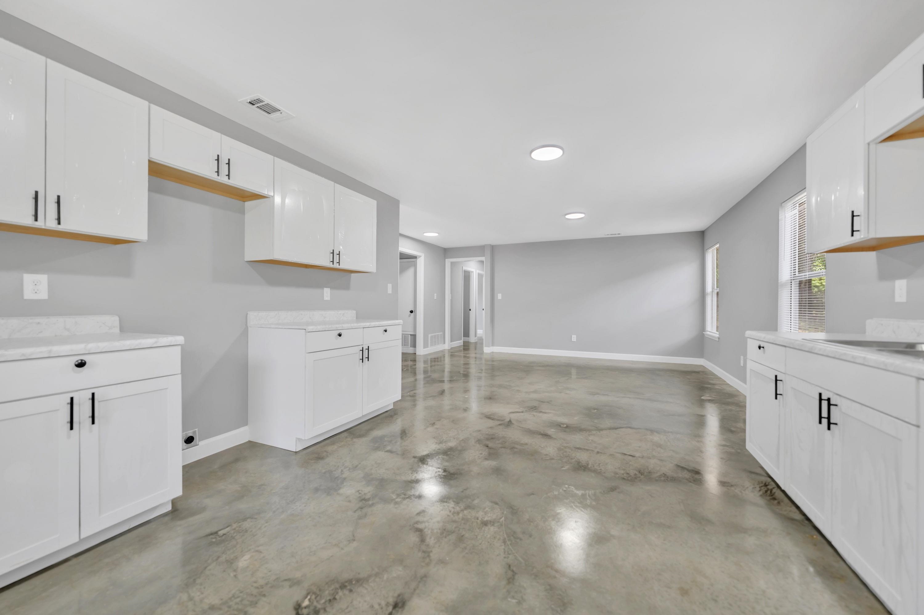 718 Hazelwood Road Memphis, TN 38109 - Photo 6 of 11 a view of a kitchen with white cabinets