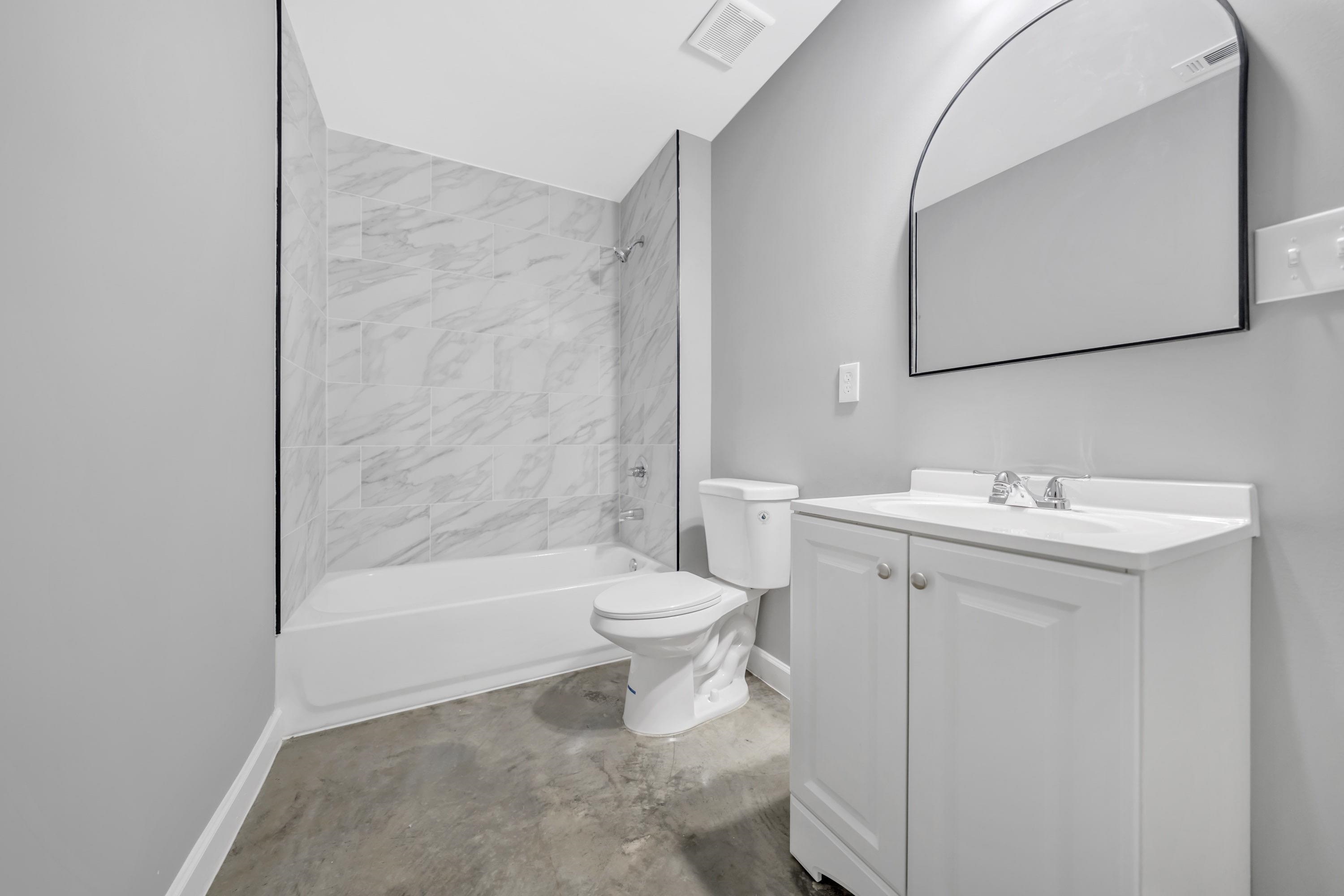 718 Hazelwood Road Memphis, TN 38109 - Photo 9 of 11 a bathroom with a sink toilet and shower