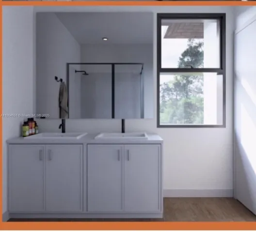 a bathroom with a sink a mirror and a window