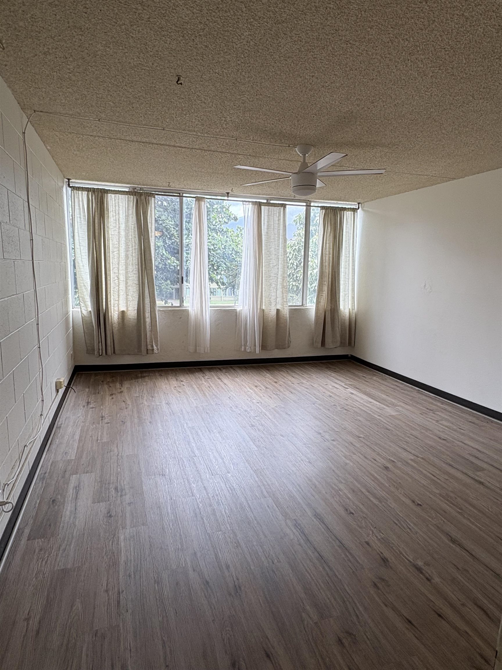 111 Kahului Beach Road, Unit A315 Kahului, HI 96732 - Photo 2 of 6 a view of room with hardwood floor and window