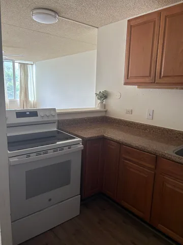 a view of a kitchen with sink and dishwasher