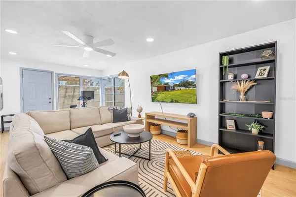 a living room with furniture and a flat screen tv
