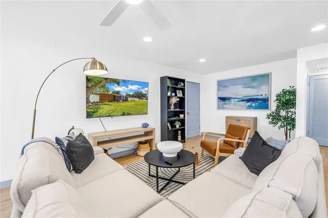 a living room with furniture and a large window