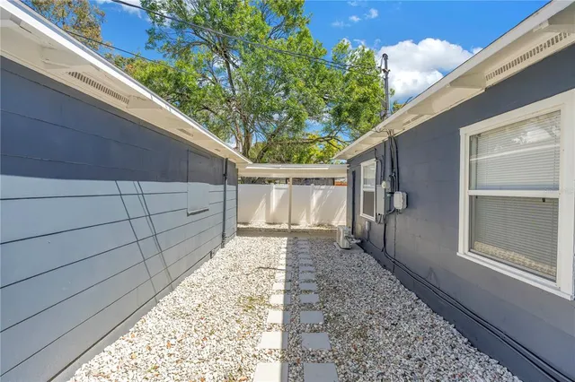 a backyard of a house with lots of green space and garage