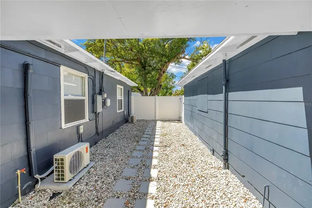 a bedroom with bed and a window