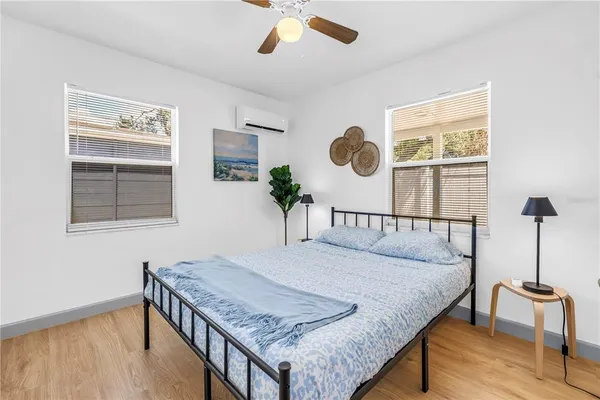 a bedroom with a bed and window