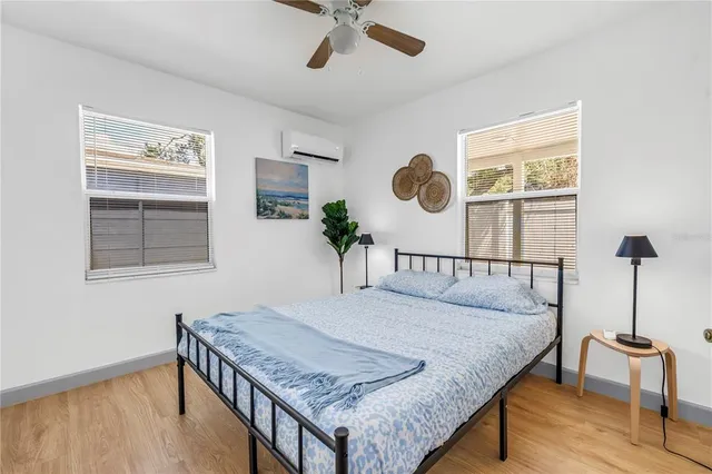 a bedroom with a bed and window