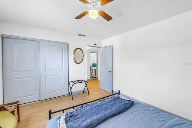 a living room with wooden floor furniture and a window
