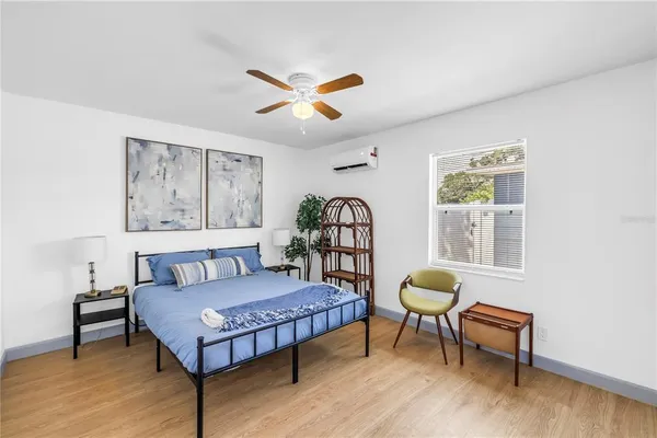 a living room with furniture a rug and a window