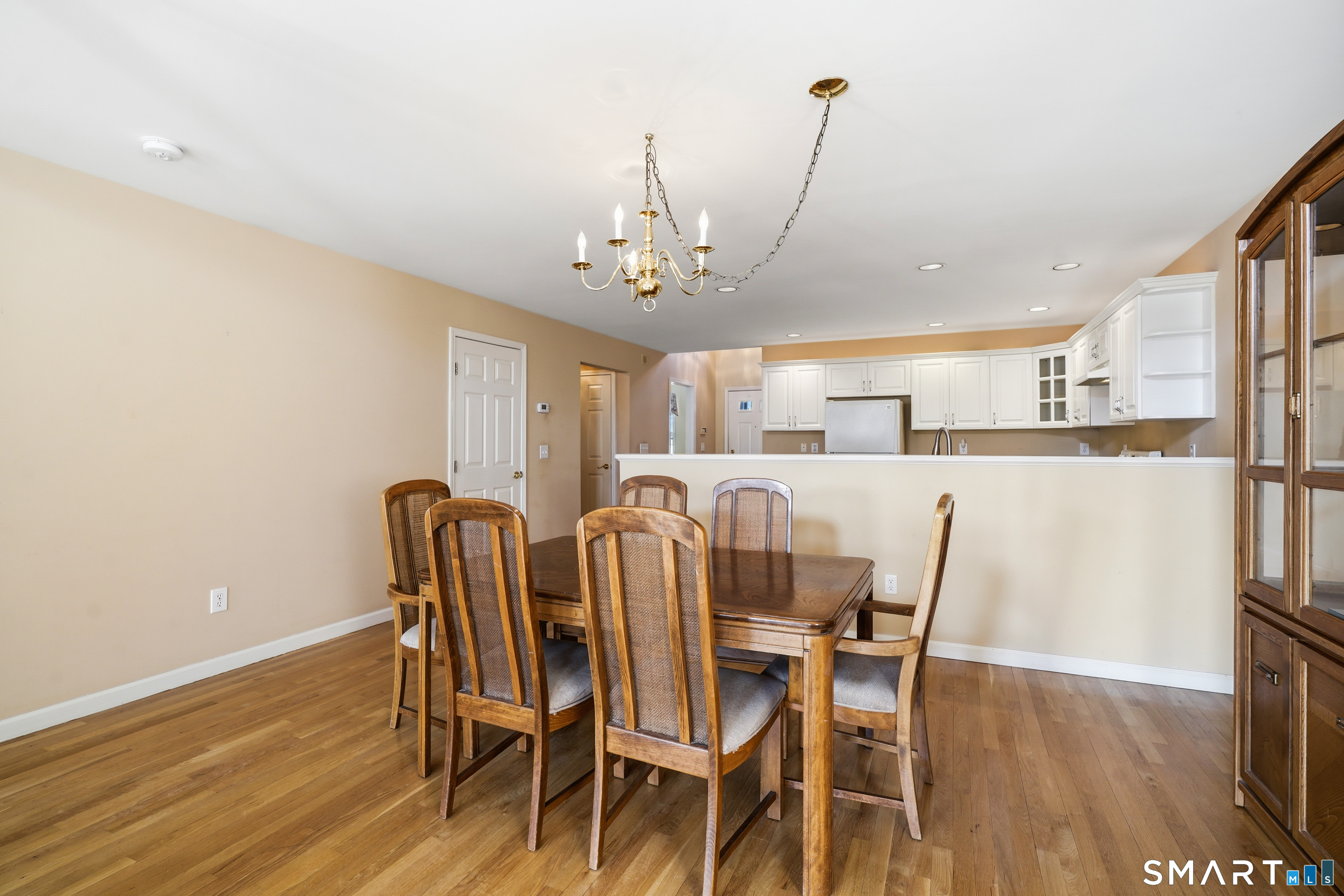 31 St George Place, Unit 31 Newtown, CT 06482 - Photo 12 of 30 a view of a dining room with furniture and wooden floor