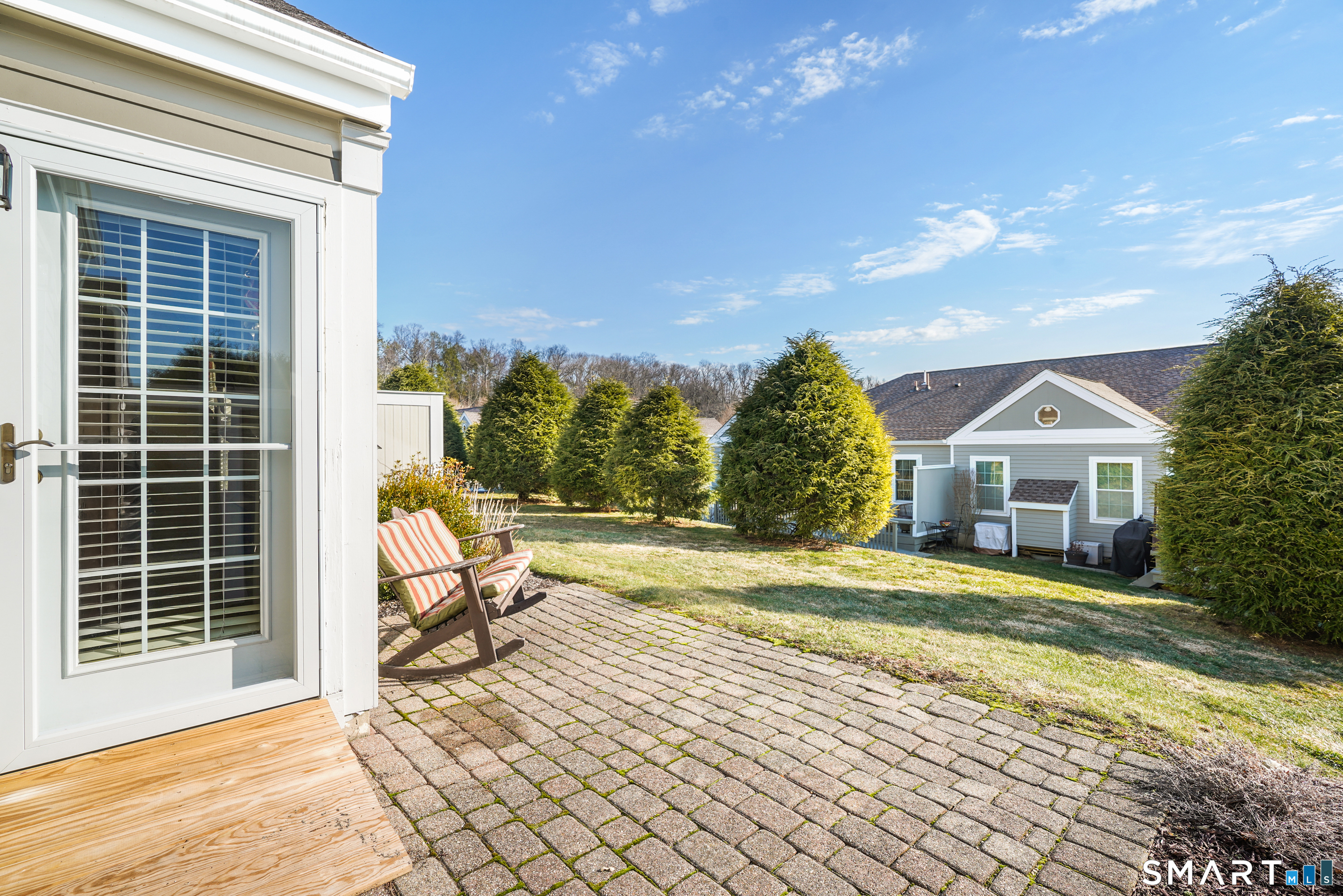 31 St George Place, Unit 31 Newtown, CT 06482 - Photo 30 of 30 a view of a house with backyard and sitting area
