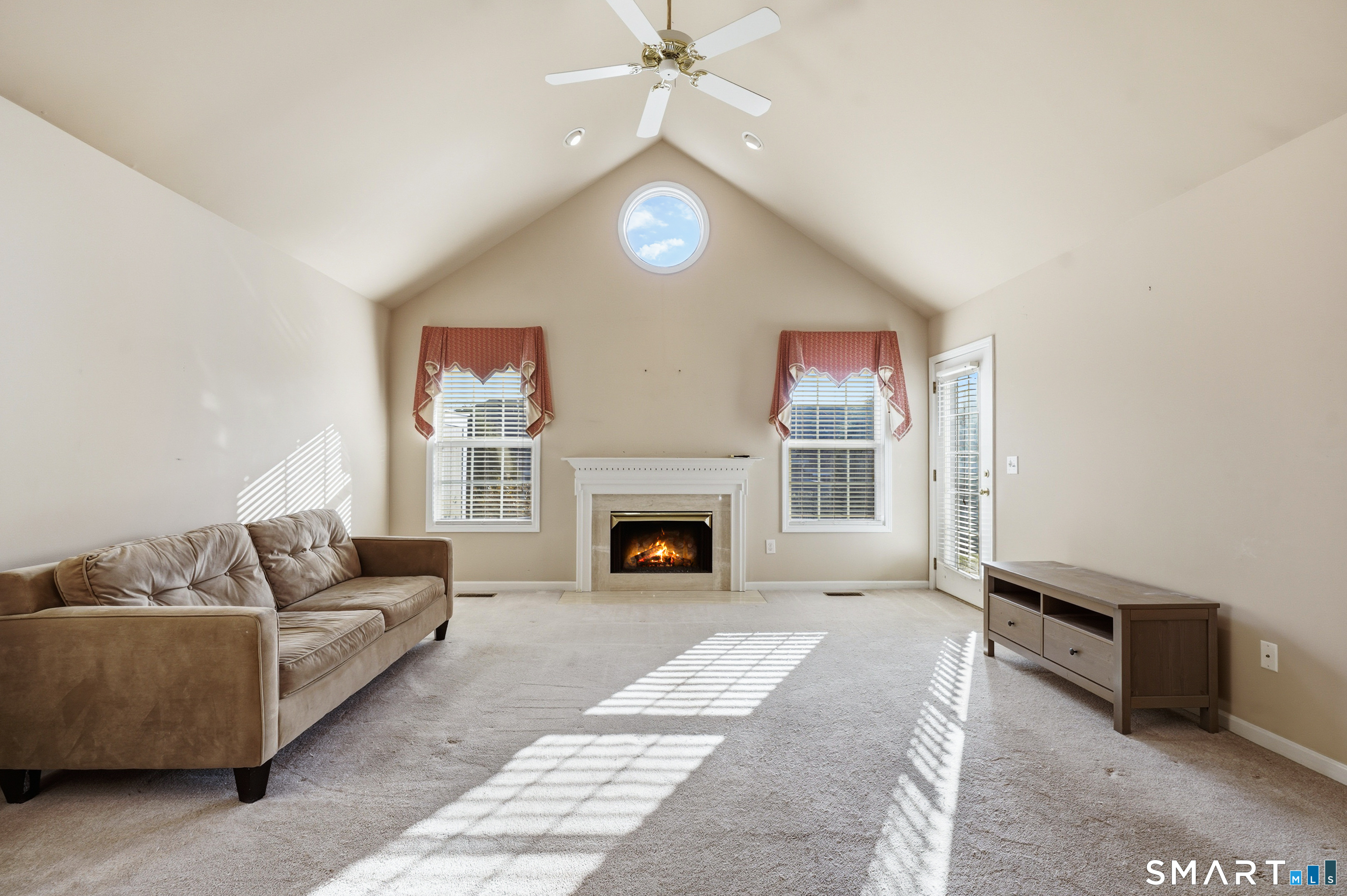 31 St George Place, Unit 31 Newtown, CT 06482 - Photo 3 of 30 a living room with furniture and a fireplace