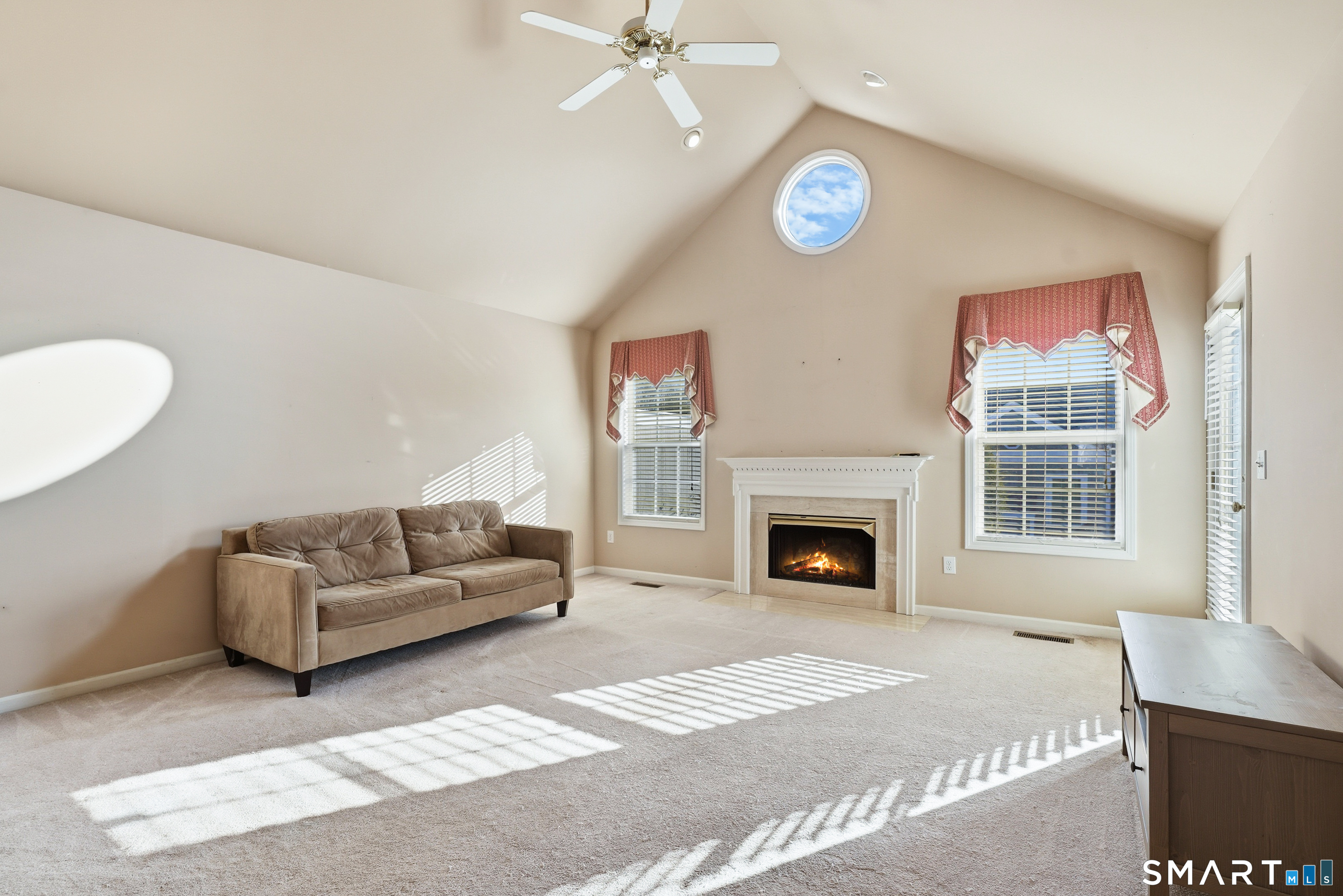 31 St George Place, Unit 31 Newtown, CT 06482 - Photo 4 of 30 a living room with furniture a fireplace and a table