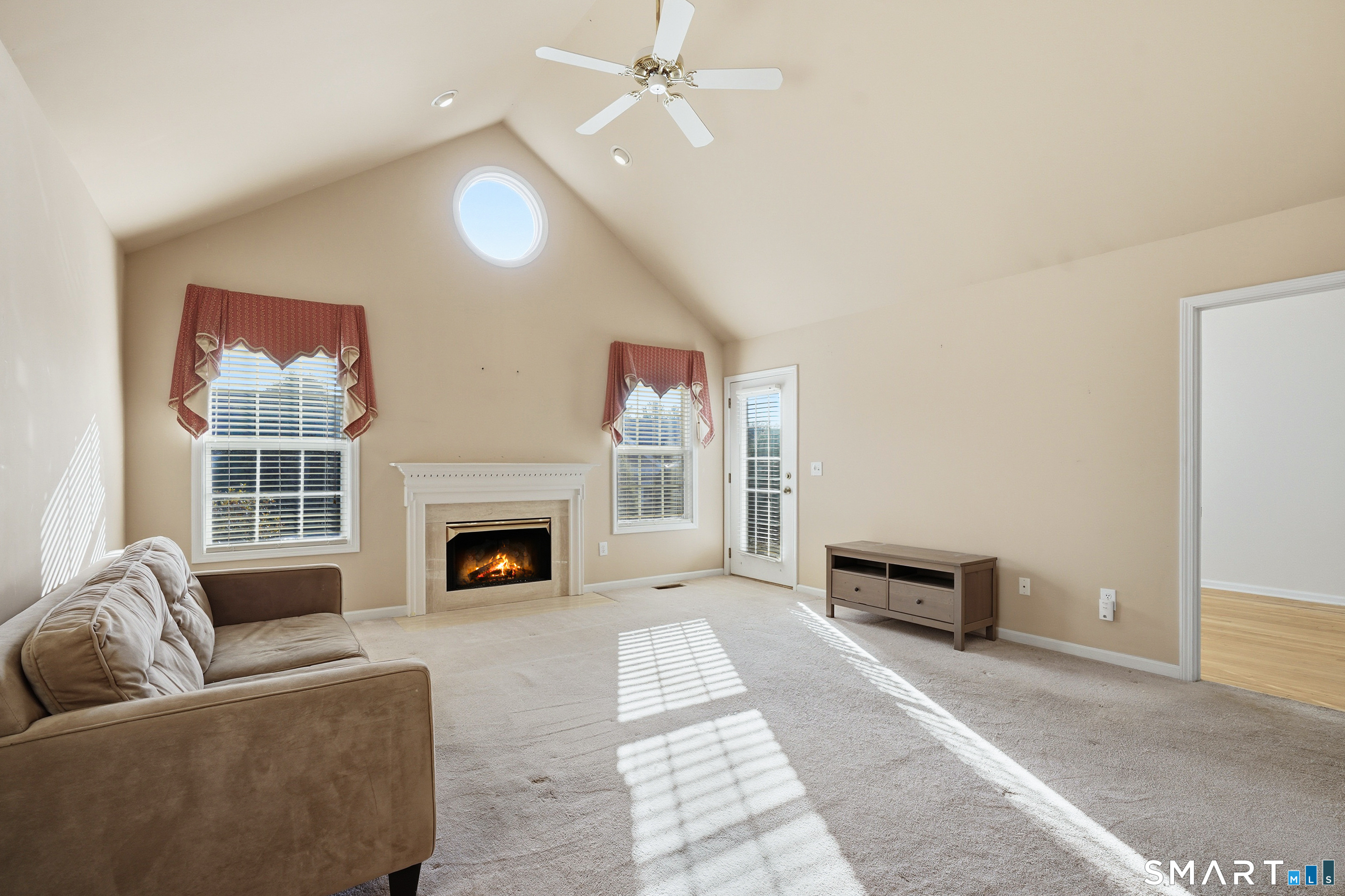 31 St George Place, Unit 31 Newtown, CT 06482 - Photo 7 of 30 a living room with furniture mirror and a fireplace