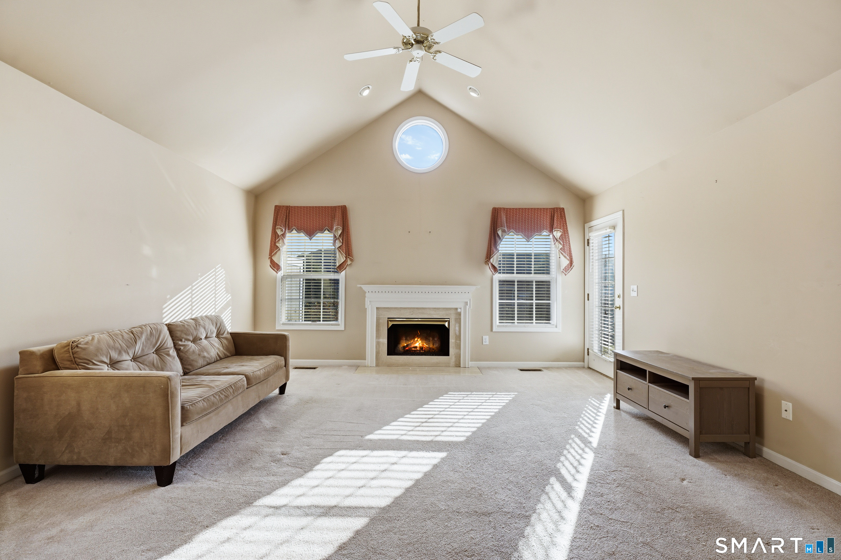 31 St George Place, Unit 31 Newtown, CT 06482 - Photo 8 of 30 a living room with furniture and a fireplace
