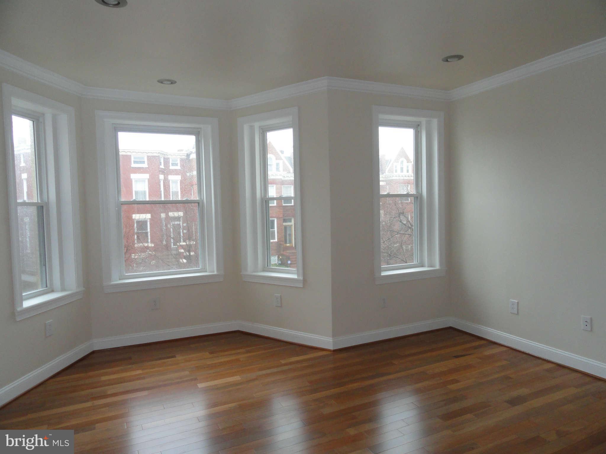 27 R Street Northeast Washington, DC 20002 - Photo 12 of 30 Master Bedroom w/Hardwood Floors and Natural Light