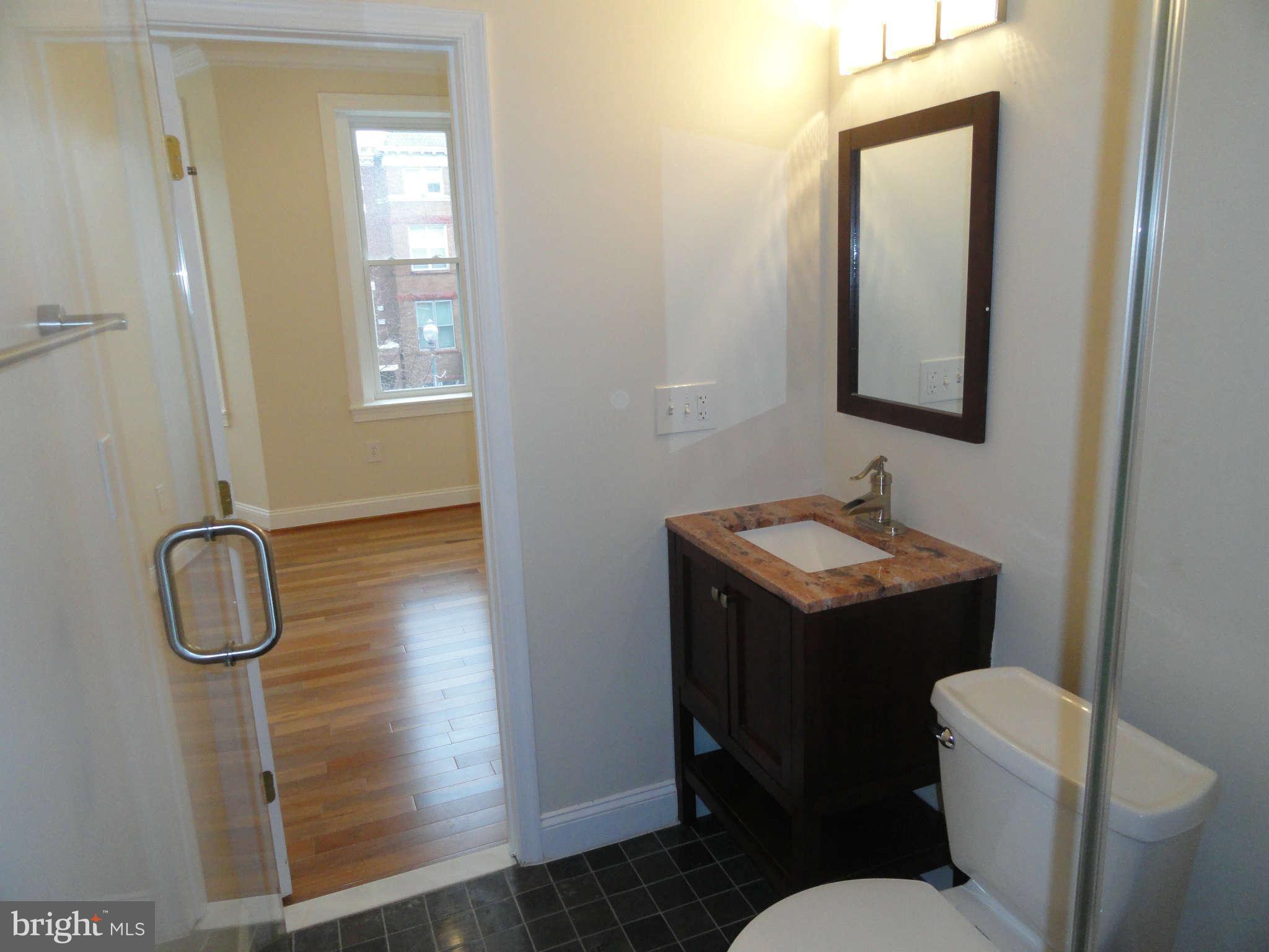 27 R Street Northeast Washington, DC 20002 - Photo 15 of 30 Comfortable Master Bath with Tiled Floor