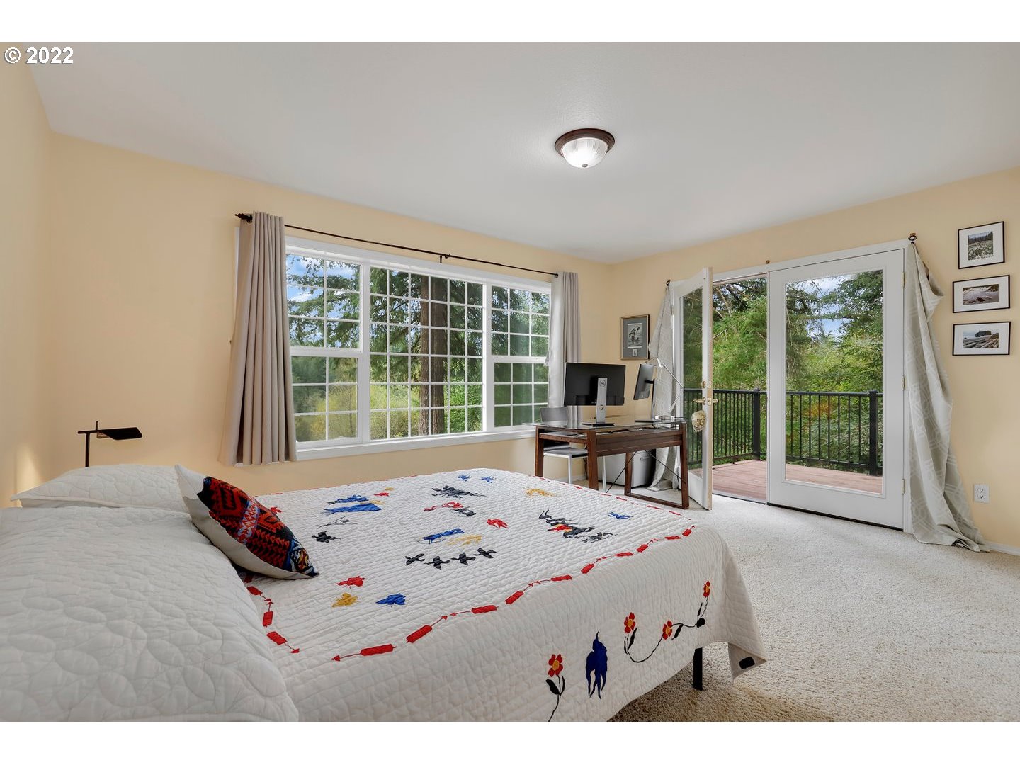 27507 Northeast 42nd Circle Camas, WA 98607 - Photo 12 of 30 a bedroom with a bed and large windows