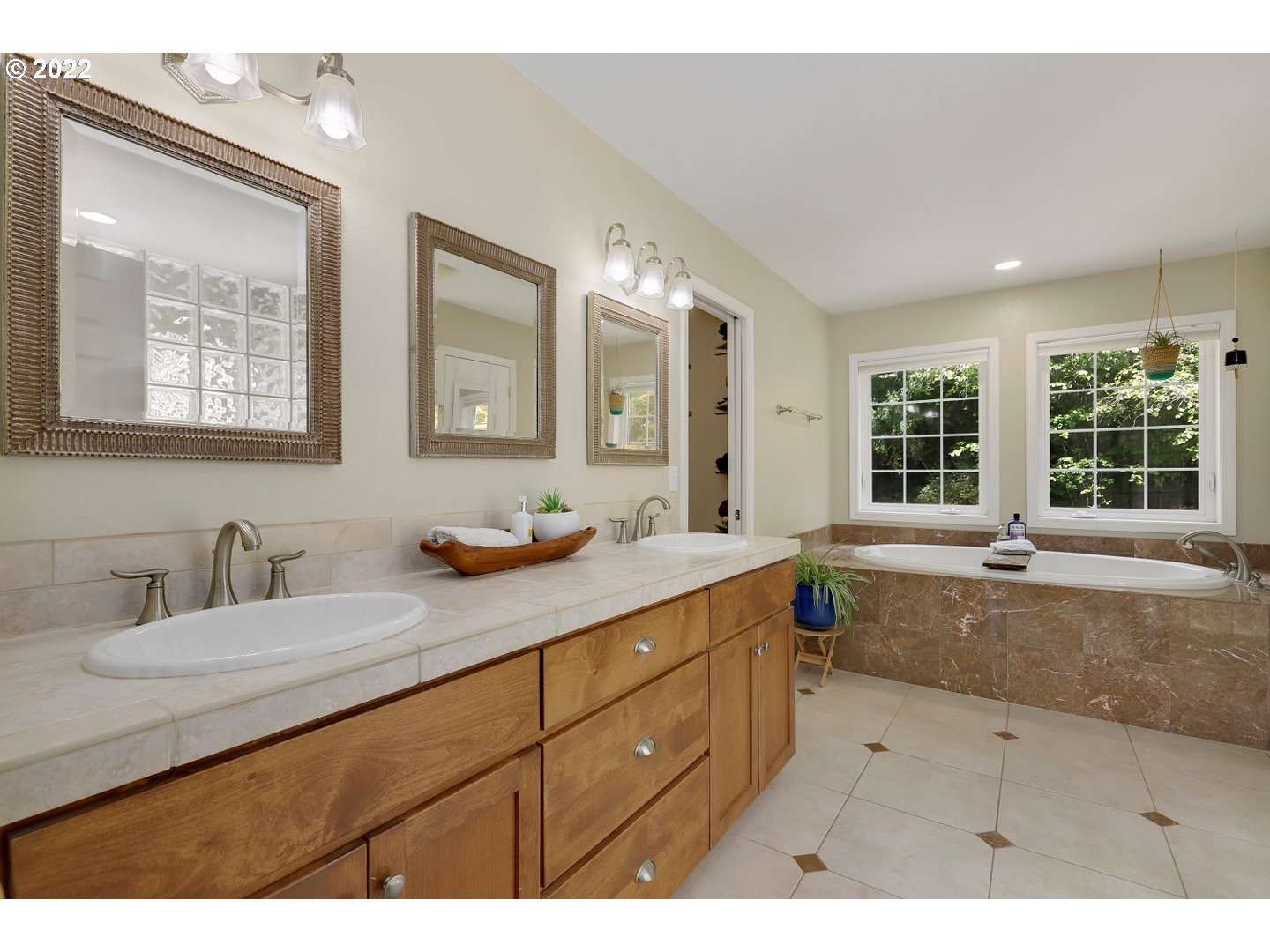 27507 Northeast 42nd Circle Camas, WA 98607 - Photo 15 of 30 a bathroom with a tub a sink and a large mirror