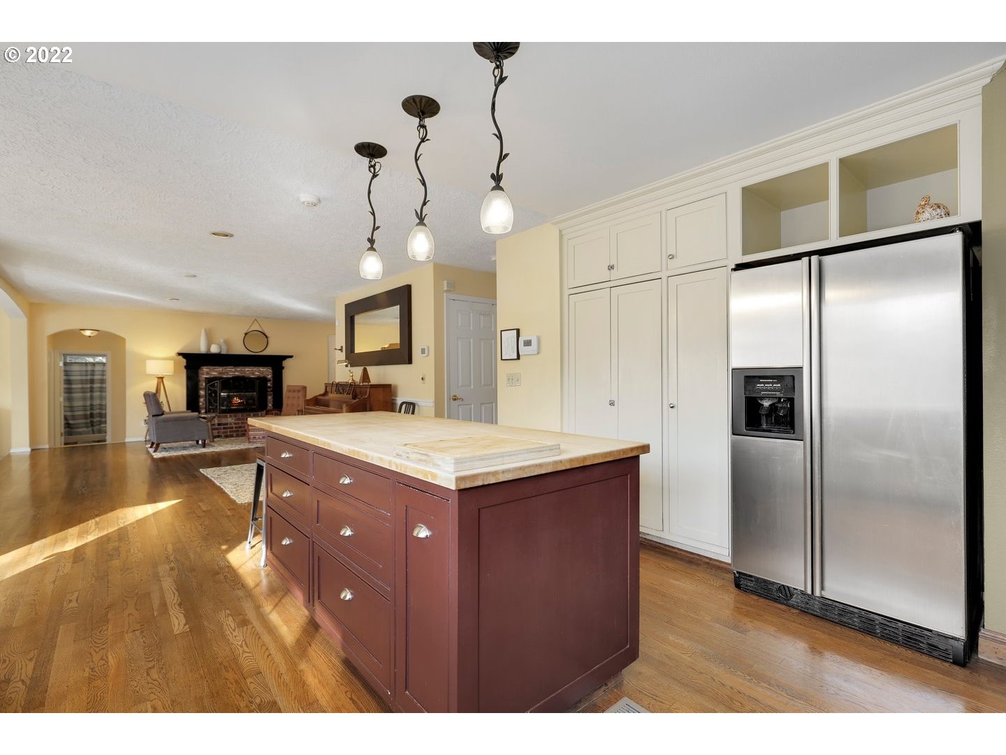 27507 Northeast 42nd Circle Camas, WA 98607 - Photo 10 of 30 a kitchen with a refrigerator a sink and a wooden floor
