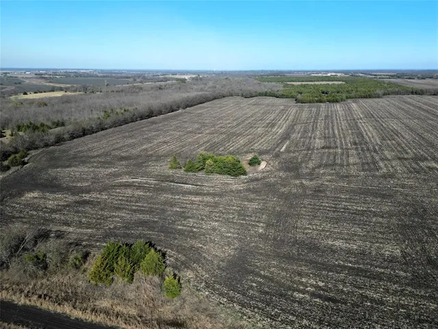 a view of an ocean beach and mountain