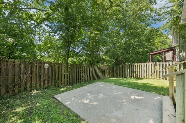 a view of a backyard with a small cabin