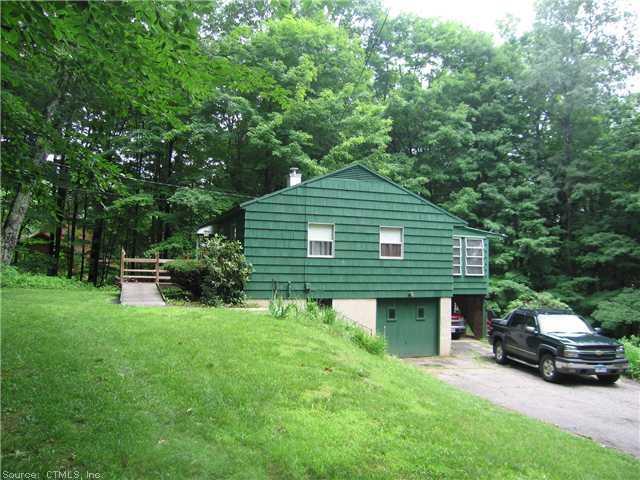 142 Smith Hill Road Winchester, CT 06098 - Photo 1 of 1 a front view of a house with a garden