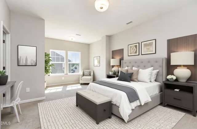 a bedroom with a large bed and a couch