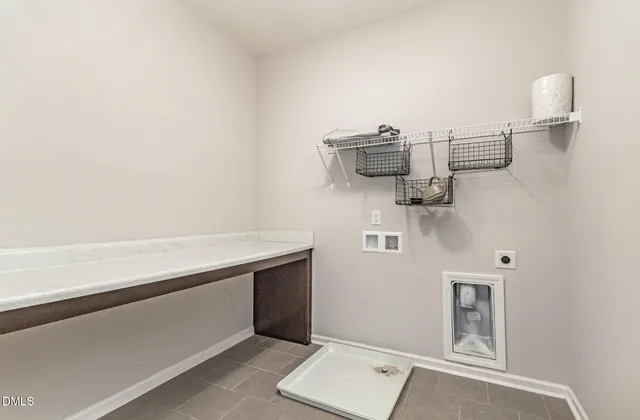 a view of a livingroom with workspace and a window