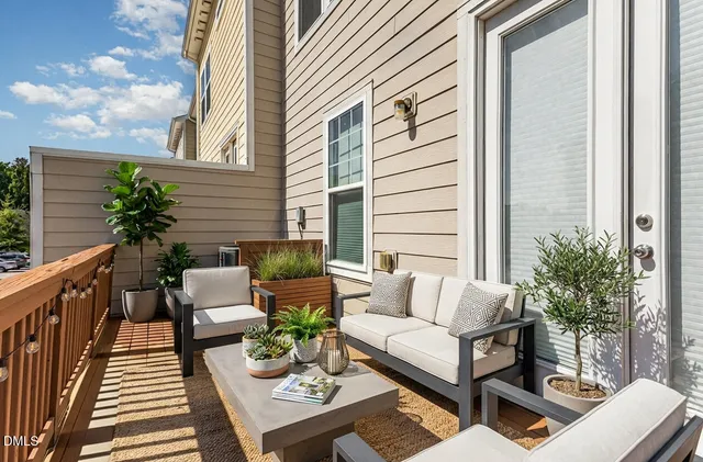 a view of a wooden deck with furniture