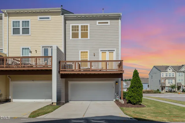 a front view of a building with a garden