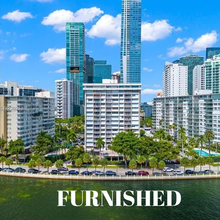 a view of a city with tall buildings